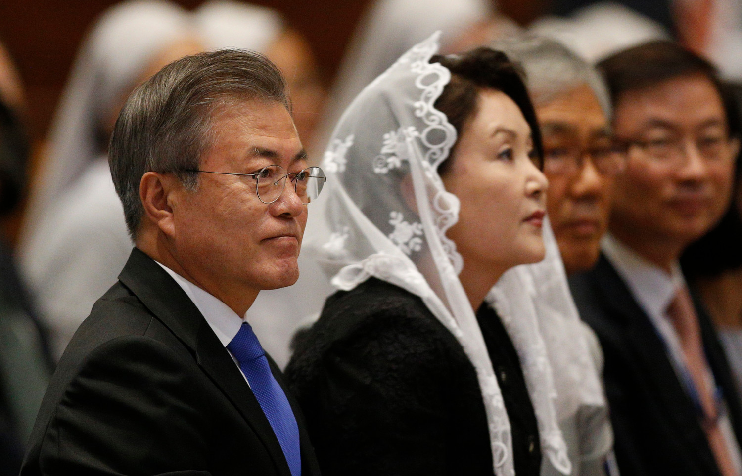 South Korean President Moon Jae-in, left, attends a Mass for peace for the Korean peninsula in St. Peter’s Basilica at the Vatican Oct. 17. The Mass was celebrated by Cardinal Pietro Parolin, Vatican secretary of state.